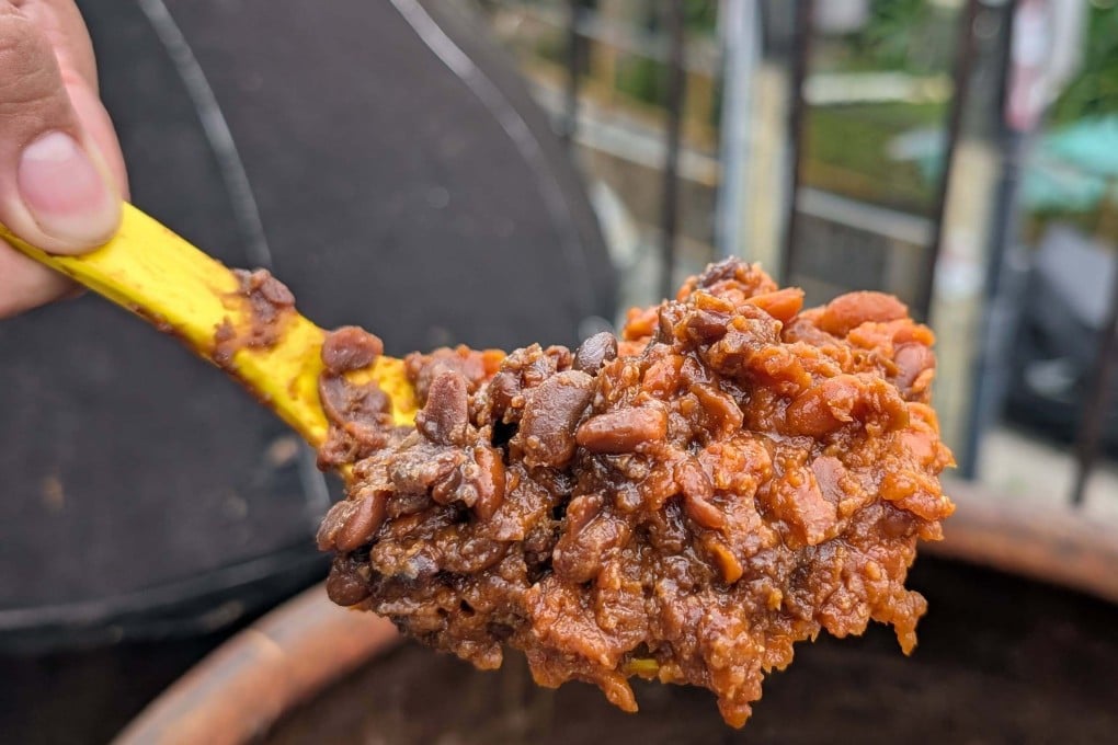 A ladle of partly fermented bean paste at Hong Kong sauce maker Yuet Wo, which makes fresh, unpasteurised miso. The process of making Chinese miso is simpler than that for Japanese miso, Yuet Wo’s owner says. Photo: Lisa Cam