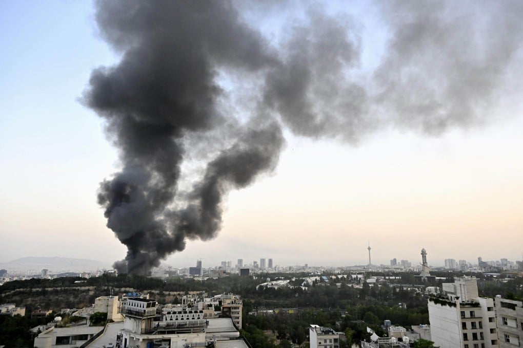 Black smoke billows from the headquarters of Iranian state television in Tehran following an Israeli attack on June 16. Photo: Kyodo