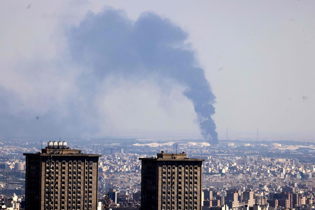 Smoke billows from an Iranian oil refinery following an Israeli strike on Tehran on June 17. Photo: AFP