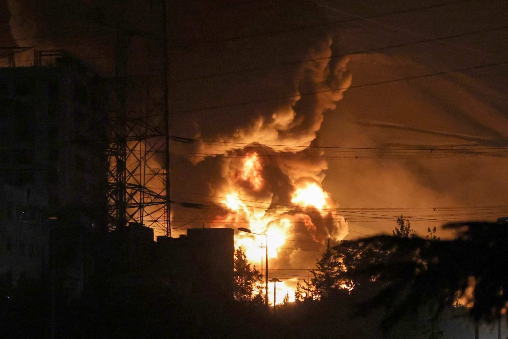 A fire blazes at an oil depot northwest of Iran’s capital Tehran on Sunday following an Israeli strike. Photo: AFP
