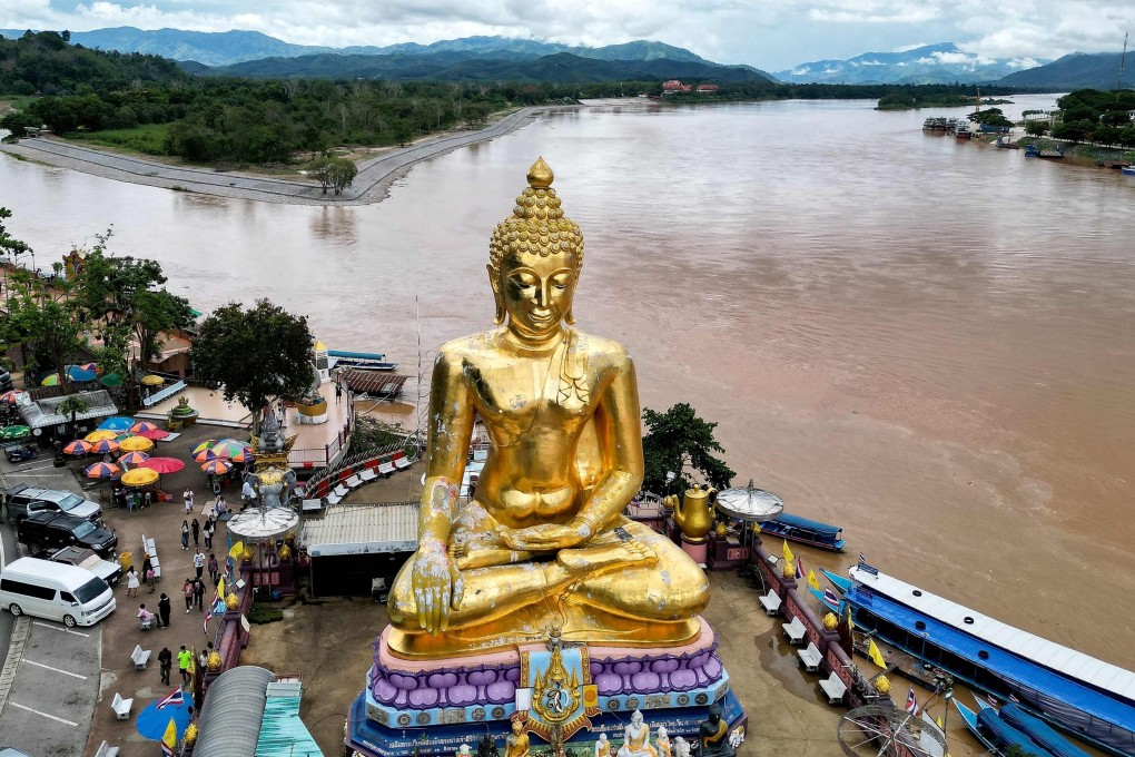 A giant Buddha statue in northern Thailand’s Chiang Rai province, with Thailand on the left and Myanmar in the centre,  A  new mine in northeast Myanmar is being blamed for rising pollution levels downstream in Thailand. Photo: AFP