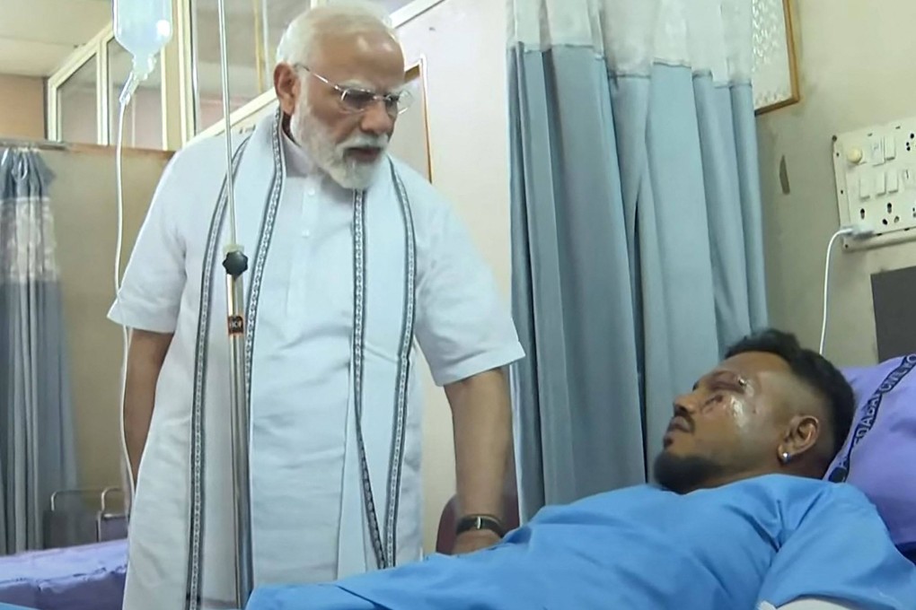 Indian Prime Minister Narendra Modi (left) meets Vishwash Kumar Ramesh, sole survivor of the Air India flight 171 crash, at a hospital in Ahmedabad on Friday. Photo: Narendra Modi Youtube Channel/AFP