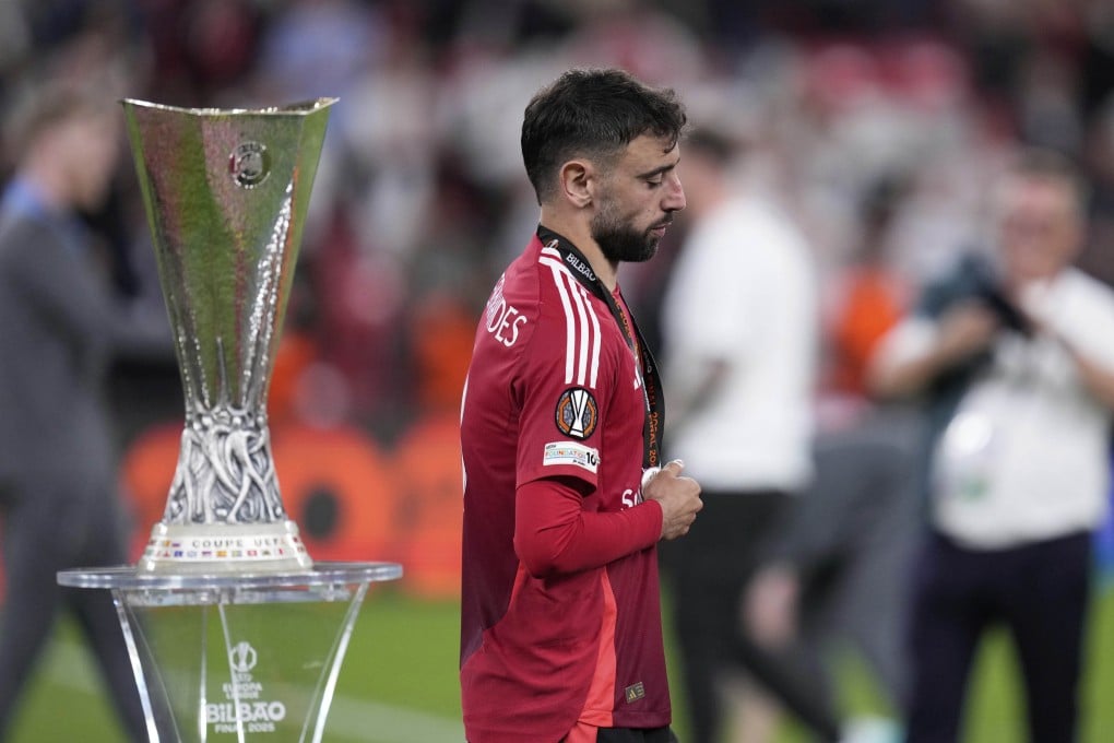 A disappointed Bruno Fernandes walks past the Europa League trophy after Manchester United’s defeat to Tottenham in the final. Photo: AP