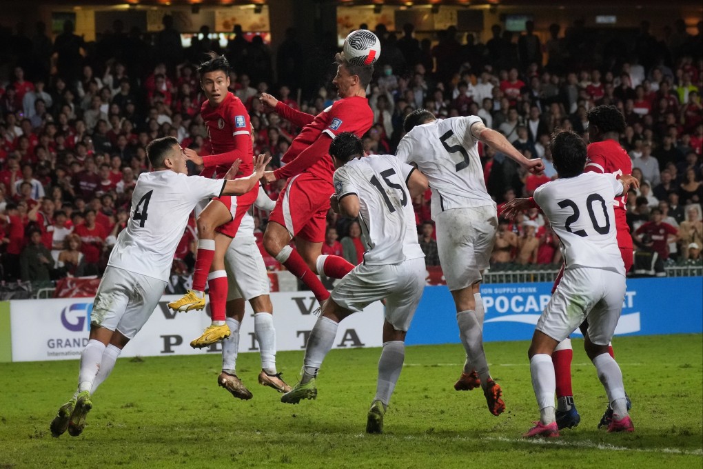 Hong Kong defender Helio Goncalves soars above a clutch of Turkmenistan defenders during a 2023 World Cup qualifier. Photo: Elson Li