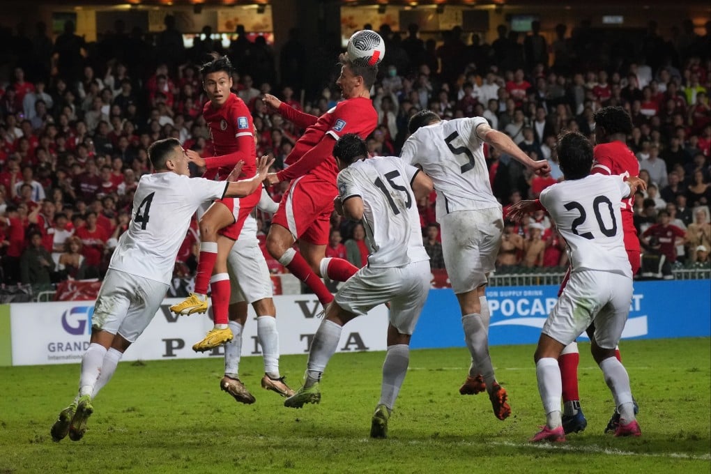 Hong Kong defender Helio Goncalves soars above a clutch of Turkmenistan defenders during a 2023 World Cup qualifier. Photo: Elson Li