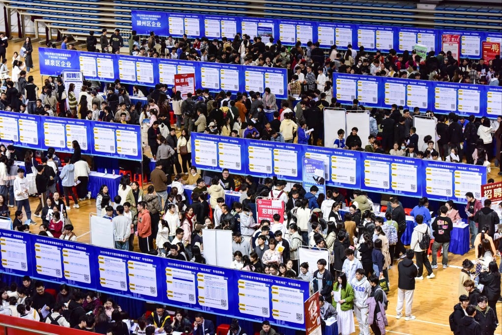 Graduates attend a job fair at a university in eastern China’s Anhui province. China’s youth unemployment rate remains stubbornly high ahead of a bumper graduation season this summer. Photo: Getty Images