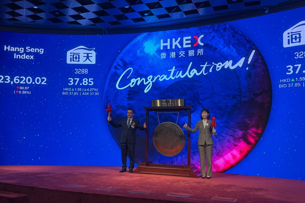 Cheng Xue (right), chairwoman of Foshan Haitian Flavouring & Food Company, after striking the ceremonial gong at the Connect Hall of the Hong Kong stock exchange to mark the trading of her company’s stock on June 19, 2025. Photo: Julie Zhang