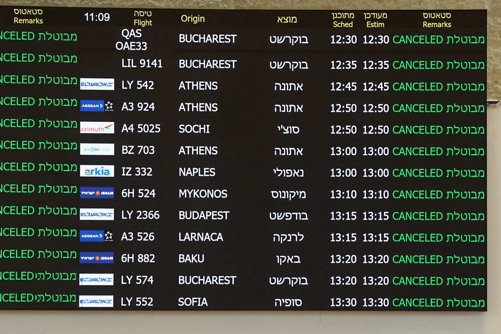 A board at the arrivals hall of Ben Gurion Airport near Tel Aviv shows cancelled flights on June 13 after Israel had closed its air space to take-off and landing. Photo: AFP