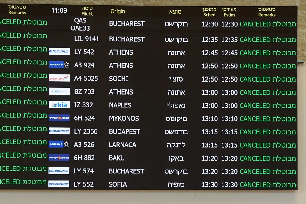 A board at the arrivals hall of Ben Gurion Airport near Tel Aviv shows cancelled flights on June 13 after Israel had closed its air space to take-off and landing. Photo: AFP