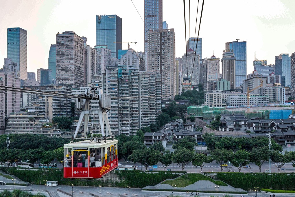 People ride a cable car in Chongqing. Photo: AFP