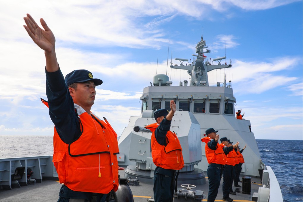 Chinese sailors wave to their Vietnamese counterparts after a joint patrol in the South China Sea in 2024. Photo: Xinhua