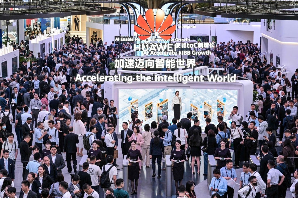People visit the Huawei booth during Mobile World Congress at the Shanghai New International Expo Centre on June 18. Photo: AFP