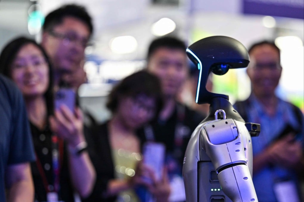 Crowds look at a Unitree robot during the Shanghai edition of the Mobile World Congress on Wednesday. Photo: AFP