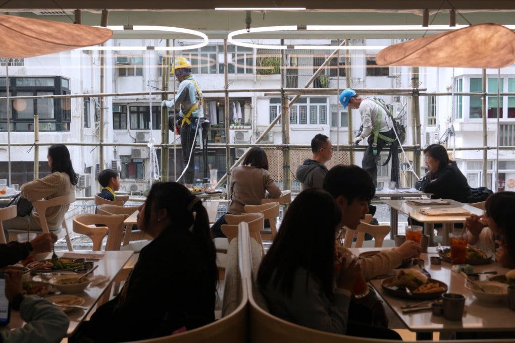 Construction workers balance on scaffolding at Causeway Place shopping centre. Hong Kong’s unemployment rate reached a 30-month high of 3.5 per cent for the March to May period. Photo: Sam Tsang