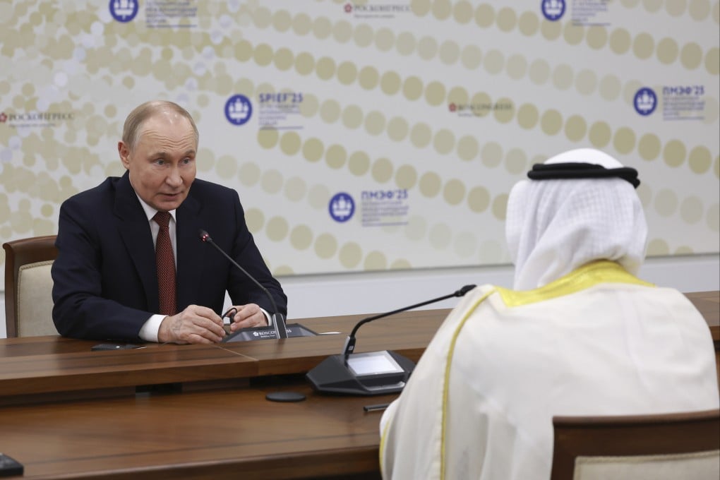 Russian President Vladimir Putin (left), speaks to OPEC Secretary-General Haitham al-Ghais during their meeting on the sidelines of the St. Petersburg International Economic Forum in Konstantin palace outside St. Petersburg, Russia, on Friday. Photo: AP