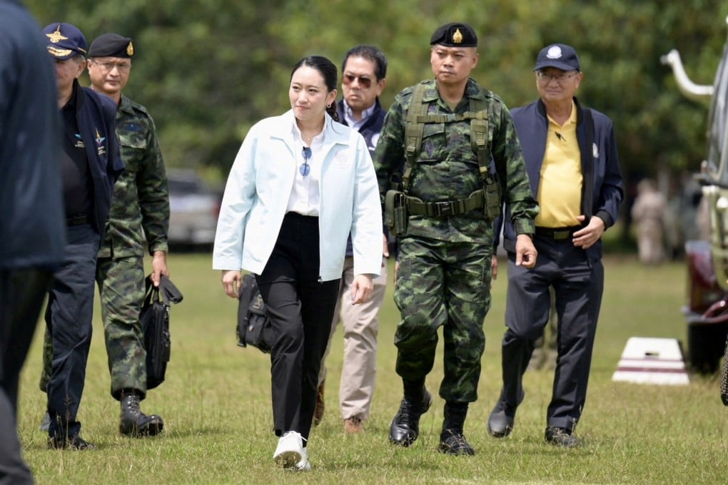 Prime Minister Paetongtarn Shinawatra walks with Second Army Region Commander Lieutenant General Boonsin Padklang, as she arrives in Ubon Ratchathani in Thailand on Friday, following a leak on Wednesday of a phone call between Paetongtarn and Cambodia’s former Prime Minister Hun Sen, amid a border dispute between the two countries. Photo: Reuters