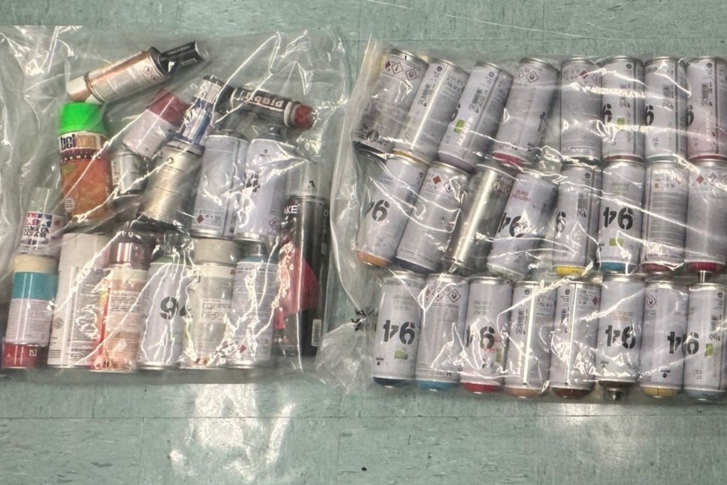 Police seized dozens of cans of spray paint during the arrest operation. Photo: Handout
