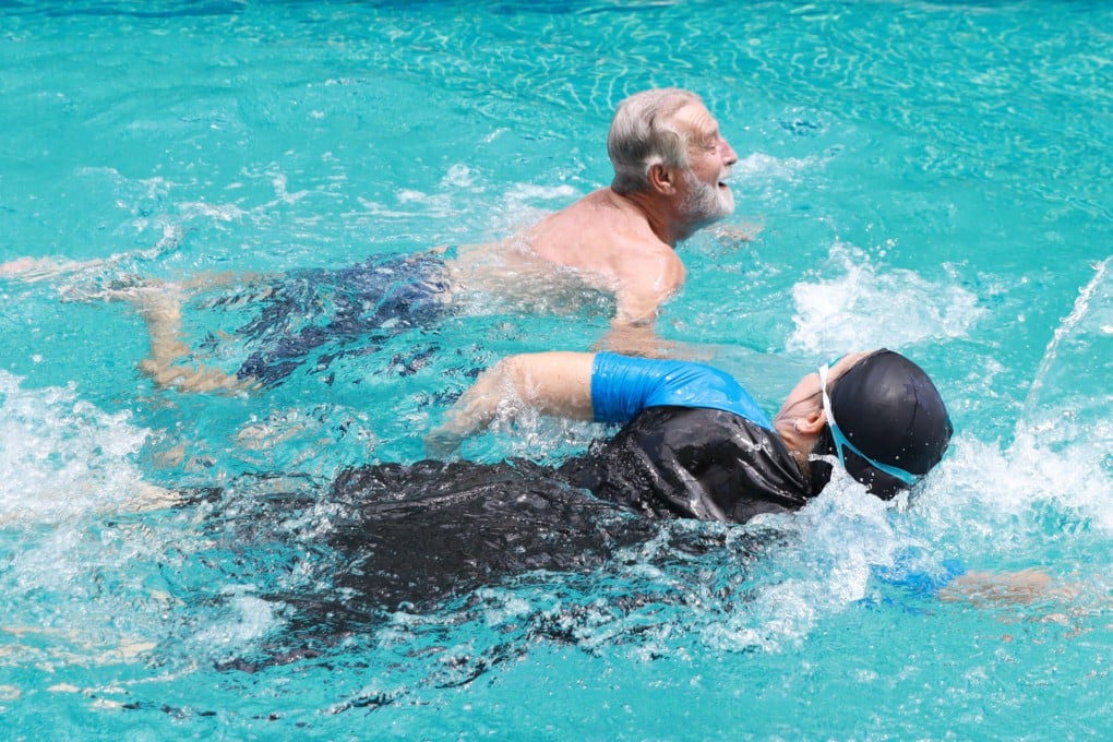 An older man swims in a pool. Researchers say one of the benefits of swimming is that it facilitates blood flow in the brain. Photo: Shutterstock