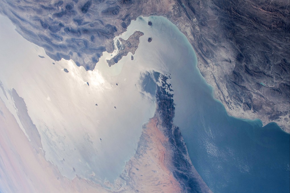 This handout photo released by NASA and taken on April 8, 2021 by the Expedition 64 crew from the International Space Station shows a view of the Strait of Hormuz in the Gulf separating Iran (top) from the United Arab Emirates and Oman (bottom). Photo: NASA/AFP