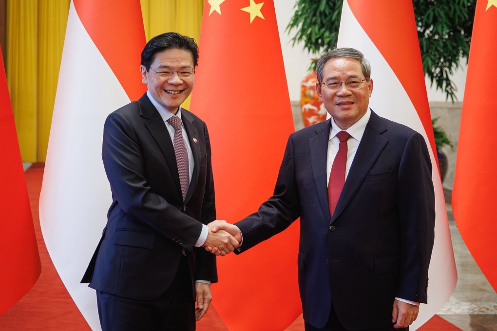 Singaporean Prime Minister Lawrence Wong (left) meets Chinese Premier Li Qiang in Beijing on Monday. Photo: Handout