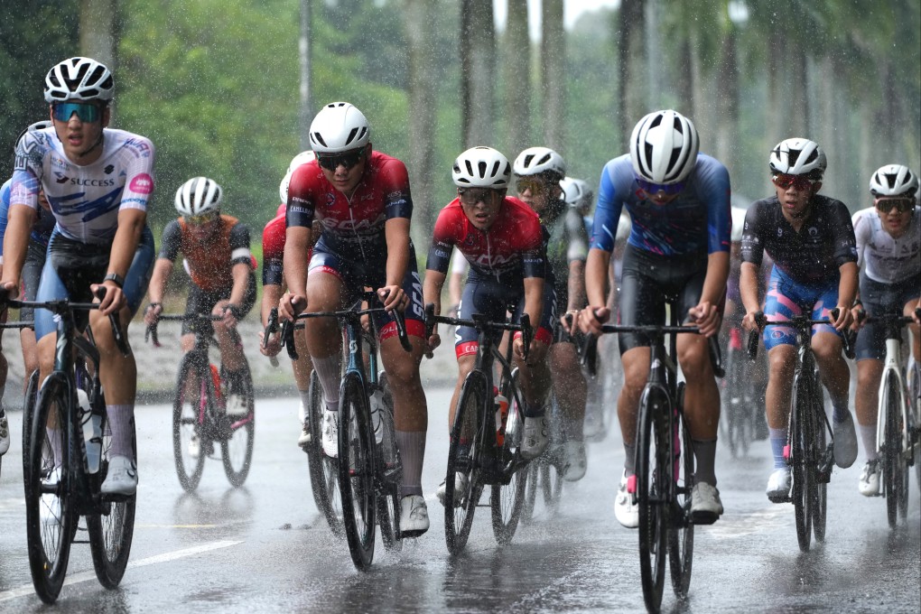 Cyclists navigate tricky conditions during the Hong Kong National Road Championships in Tin Shui Wai on Sunday. Photo: Sam Tsang