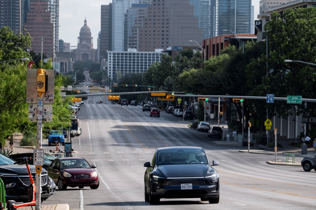 A Tesla robotaxi drives on the street along South Congress Avenue in Austin, Texas on Sunday. Photo: Reuters