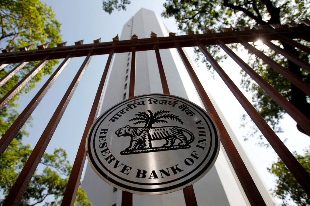 The Reserve Bank of India logo is seen outside its head office in Mumbai. The central banks of both India and Malaysia have reduced the size of some derivatives positions they use to weaken their currencies. Photo: Reuters
