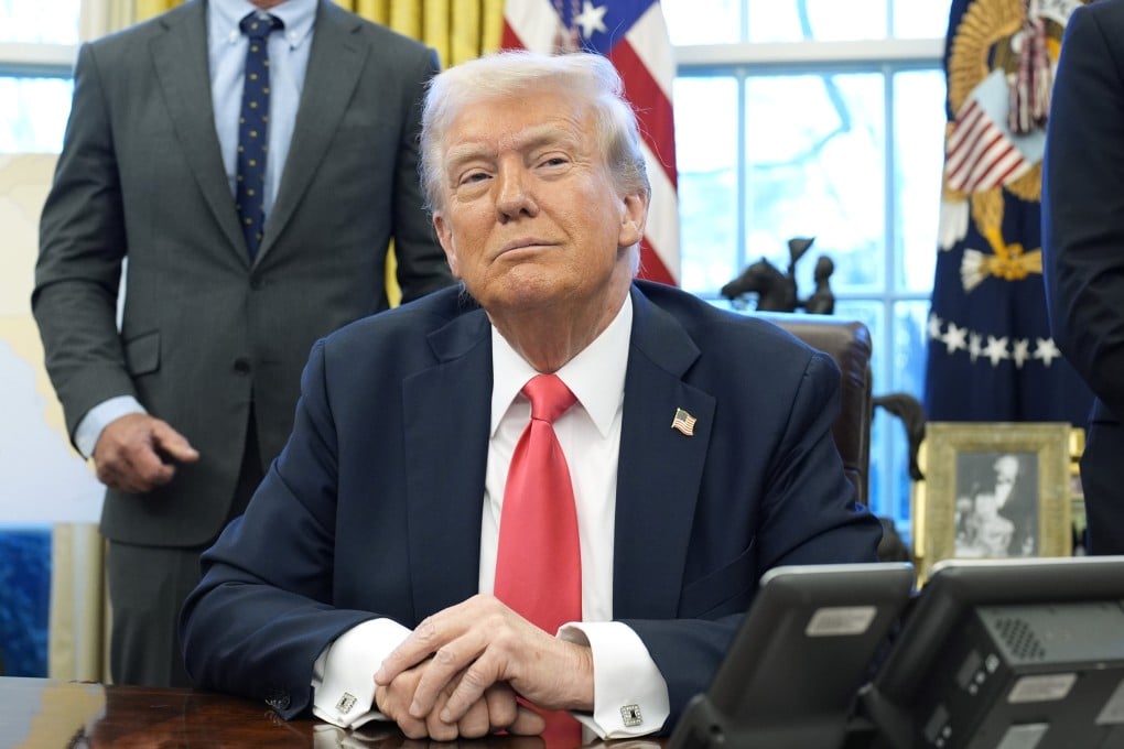US President Donald Trump speaks to reporters after signing executive orders in the Oval Office of the White House in Washington on February 25. Photo: TNS