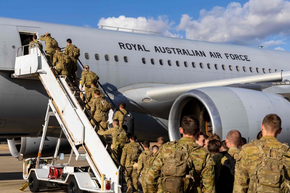 Australian soldiers board a Royal Australian Air Force aircraft last week bound for the Middle East for to assist government efforts supporting Australians seeking to leave the region. Photo: Australian Defence Force / AFP