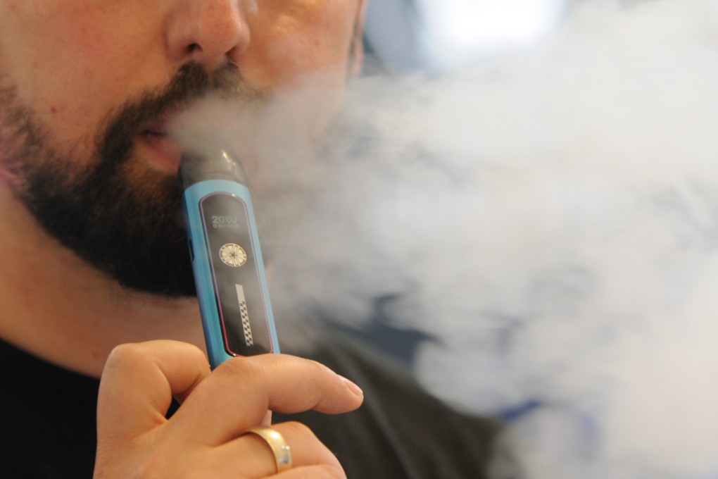 A man smoking an e-cigarette. Vaping is fast catching on in Malaysia. Photo: dpa