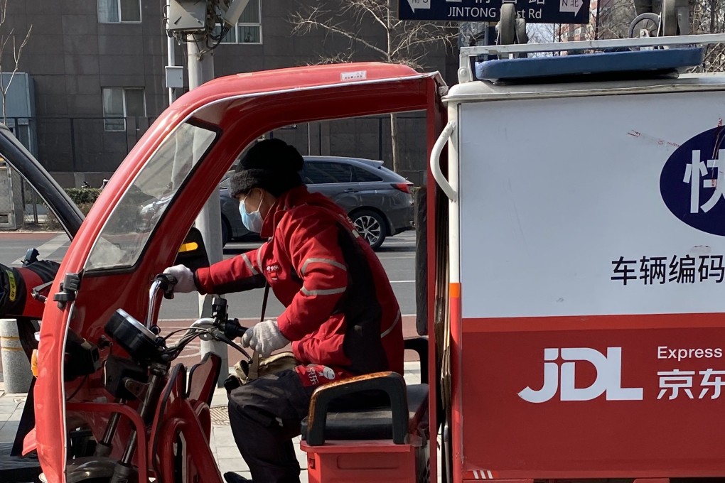 A JD Logistics delivery driver on the streets of Beijing. Photo: Minghe Hu