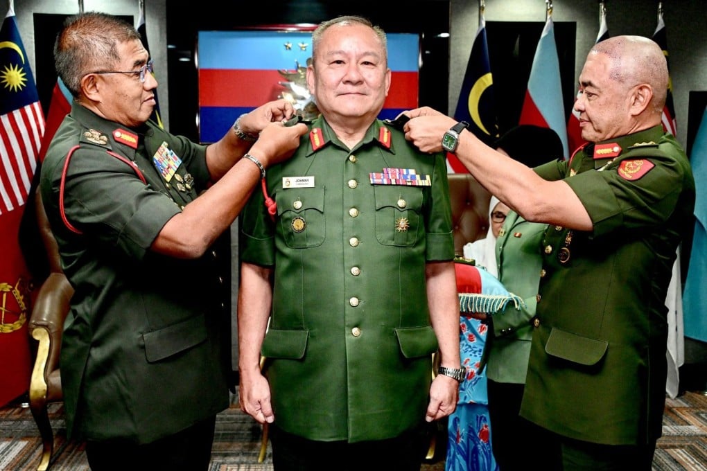 Newly minted Lieutenant General Johnny Lim Eng Seng (centre) receives his stars from Armed Forces chief General Mohd Nizam Jaffar (left) and Army Chief General Muhammad Hafizuddeain Jantan. Photo: Facebook/Malaysian Armed Forces