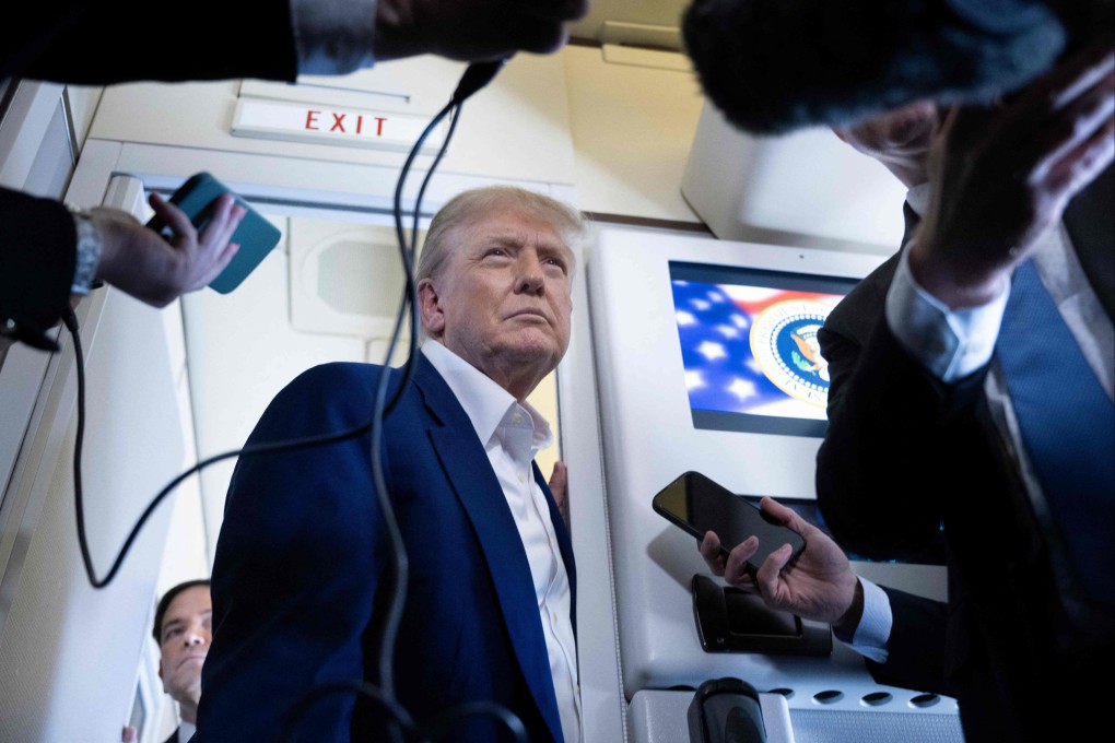 US President Donald Trump speaks to reporters aboard Air Force One on Tuesday. Photo:  AFP