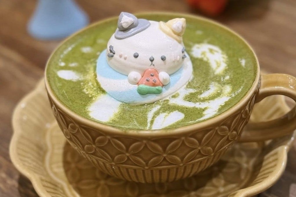 An adorable edible cat made from royal icing is delicately placed on top of coffee and other speciality drinks at Relieve, a cafe in Sheung Wan, Hong Kong. Photo: Instagram/relieve.hk