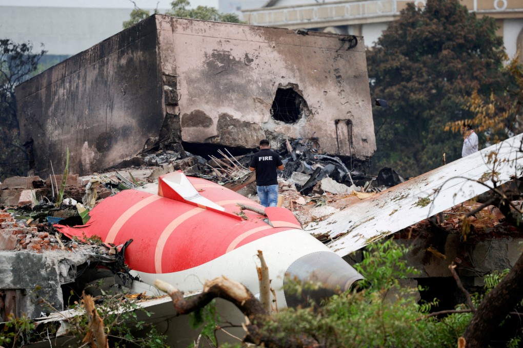 A firefighter stands next to the crashed Air India plane in Ahmedabad on June 13. Photo: Reuters