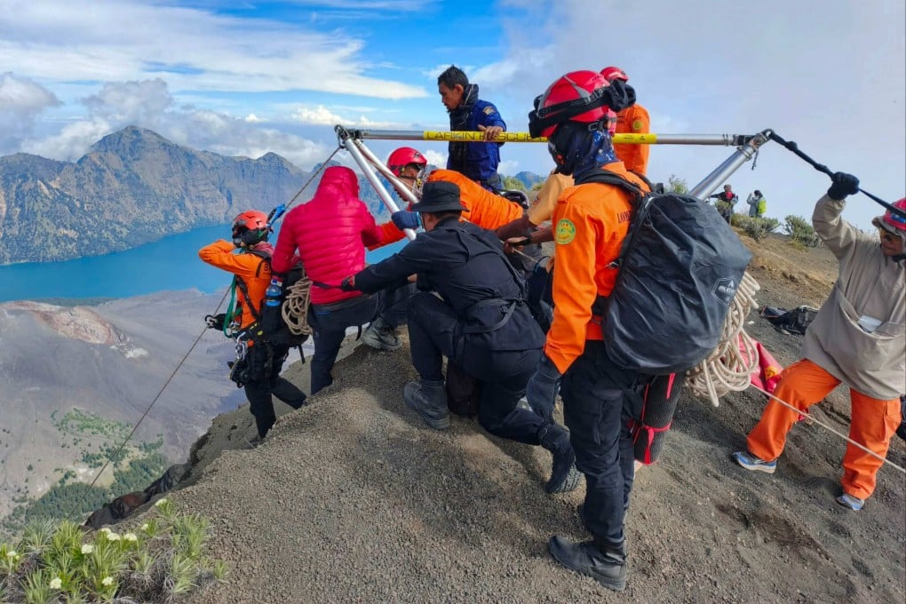Rescue workers attempt to reach Juliana Marins, a Brazilian tourist who fell into a ravine on Mount Rinjani, Lombok island, on June 21. Her body was spotted by drone and later recovered after days of search efforts hampered by bad weather and rough terrain. Photo: Indonesia’s National Search and Rescue Agency / AFP