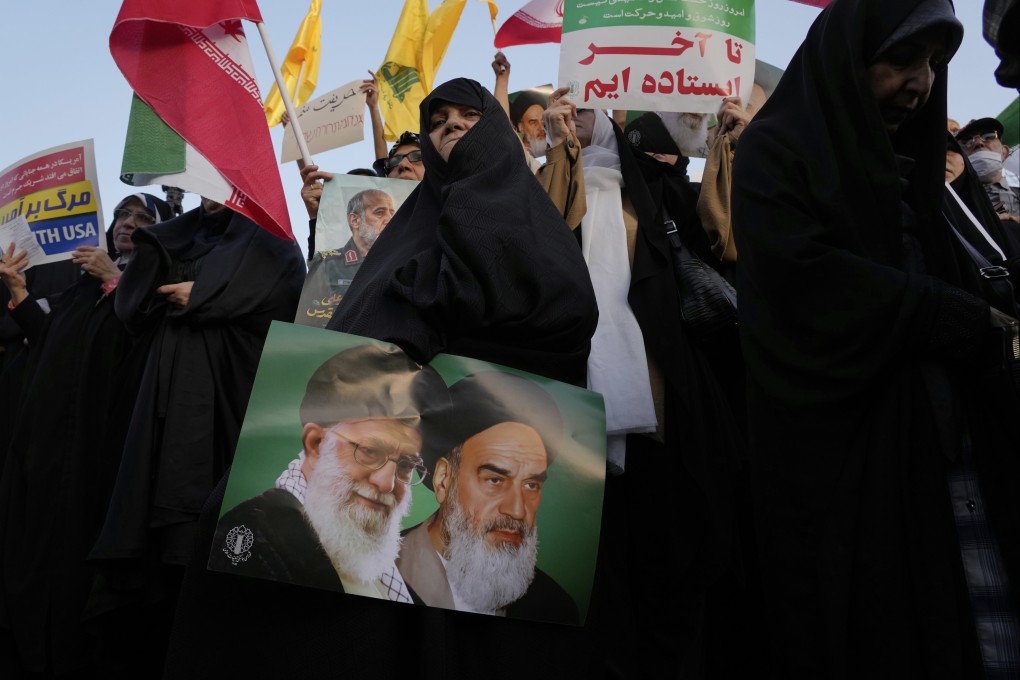 Iranians take part in an anti-US and anti-Israeli rally in downtown Tehran on Tuesday. Photo: AP
