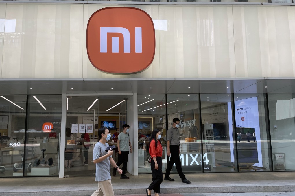 People walk past a Xiaomi store in downtown Beijing on September 8, 2021. Photo: Simon Song
