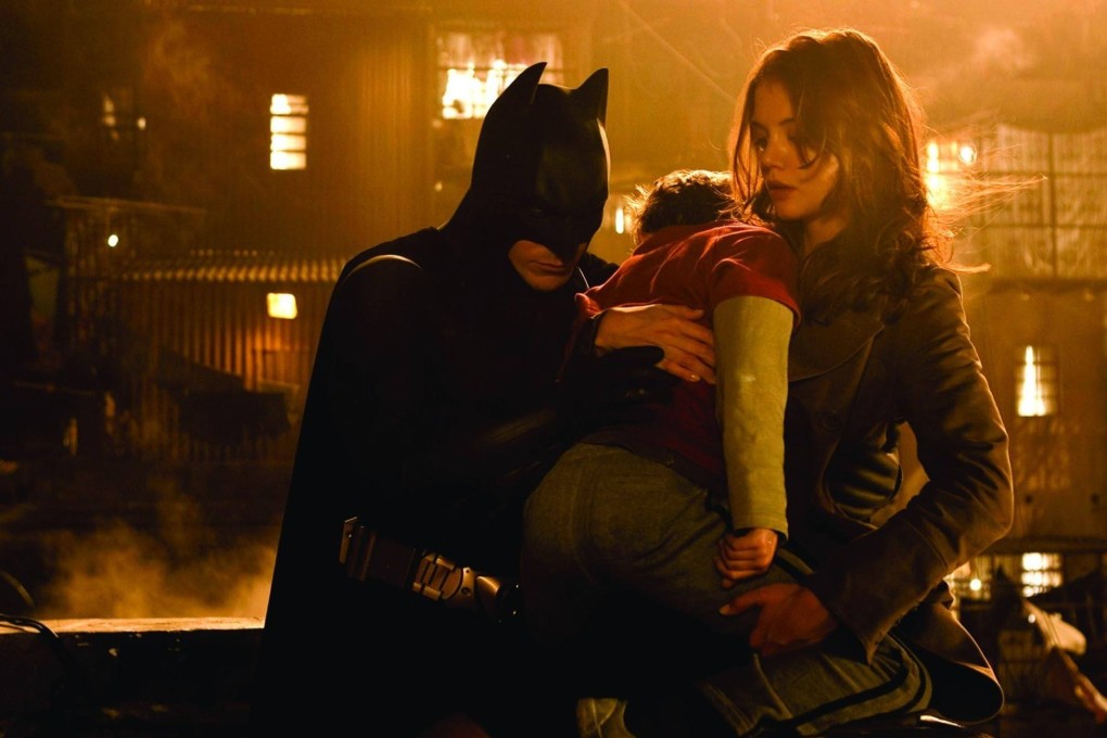 (From left) Christian Bale, Jack Gleeson and Katie Holmes in a still from Batman Begins (2005), directed by Christopher Nolan. Photo: Warner Bros Ent