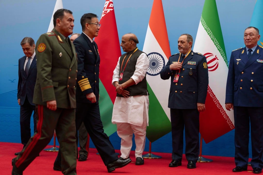 Chinese Defence Minister Dong Jun (third left) walks past Iranian Defence Minister Aziz Nasirzadeh (second right) and other SCO defence chiefs ahead of a meeting in Qingdao on Thursday. Photo: AP