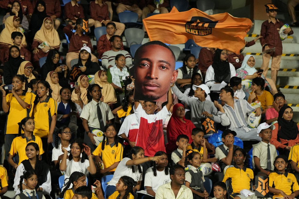 A fan holds a cutout of Kalinga Black Tigers’ Perry Baker during their match against Mumbai Dreamers’ at the Rugby Premier League in Mumbai, India on Tuesday. Photo: Reuters