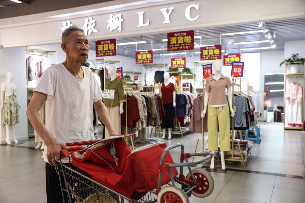 A man walks past a clothing store in Beijing on June 9. Photo: EPA-EFE