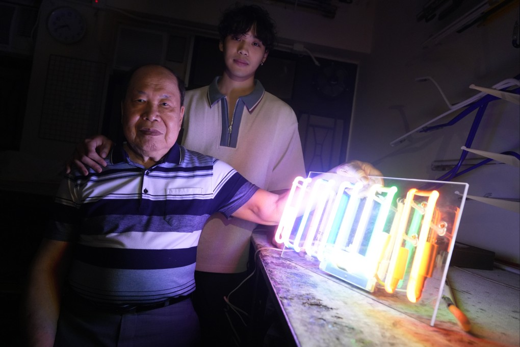 Neon master Wong Kin-wah (left) and his grandson, artist Jerry Loo, in Wong’s studio in Mong Kok, Hong Kong. Loo says the pair’s new exhibition at PMQ “is not just about neon light, it’s about legacy”. Photo: Sun Yeung