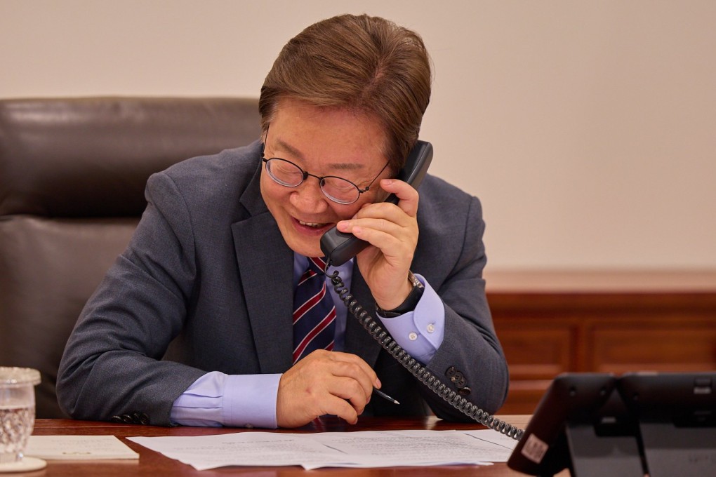 South Korean President Lee Jae-myung speaks on the phone at the presidential office in Seoul earlier this month. Photo: South Korean Presidential Office / EPA-EFE