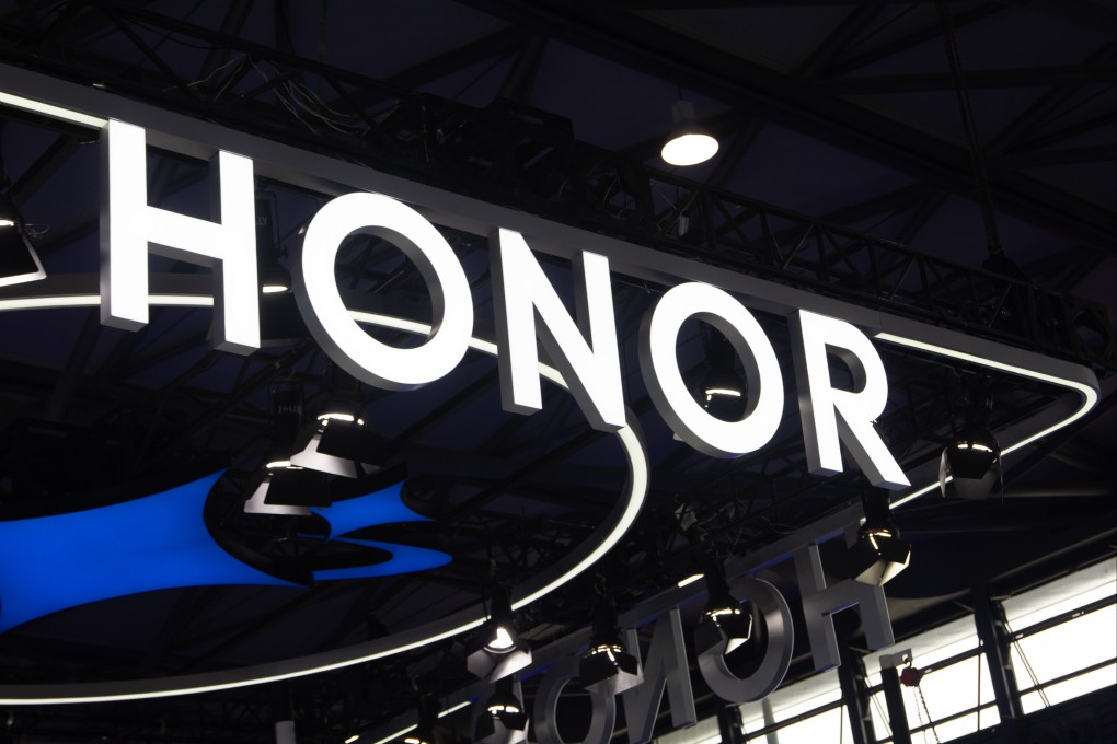Honor’s logo hangs above the smartphone maker’s booth at the Shanghai New International Expo Centre in Shanghai on June 18, 2025, during the first day of the Mobile World Conference. Photo: Getty Images