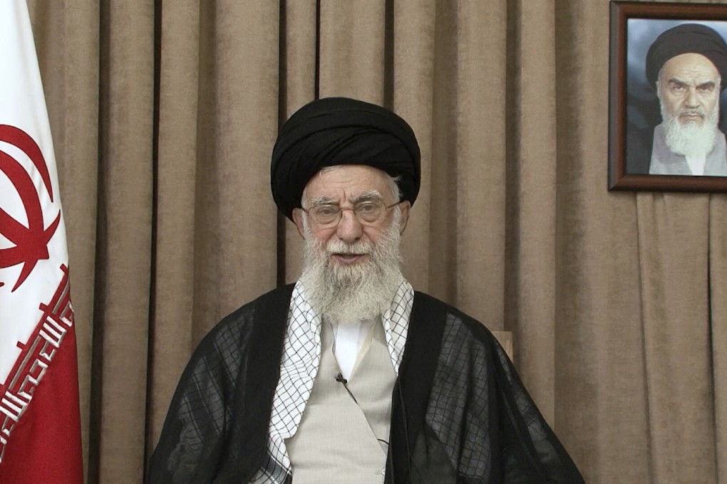 Iranian Supreme leader Ayatollah Ali Khamenei in a televised speech, under a portrait of the late revolutionary founder Ayatollah Khomeini. Photo: Office of the Iranian Supreme Leader via AP