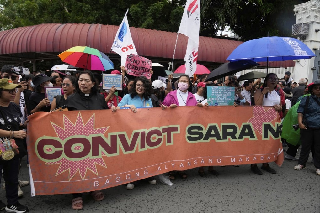 Filipino protesters hold signs calling for Vice-President Sara Duterte’s immediate Senate impeachment trial in Pasay on June 11. Photo: AP