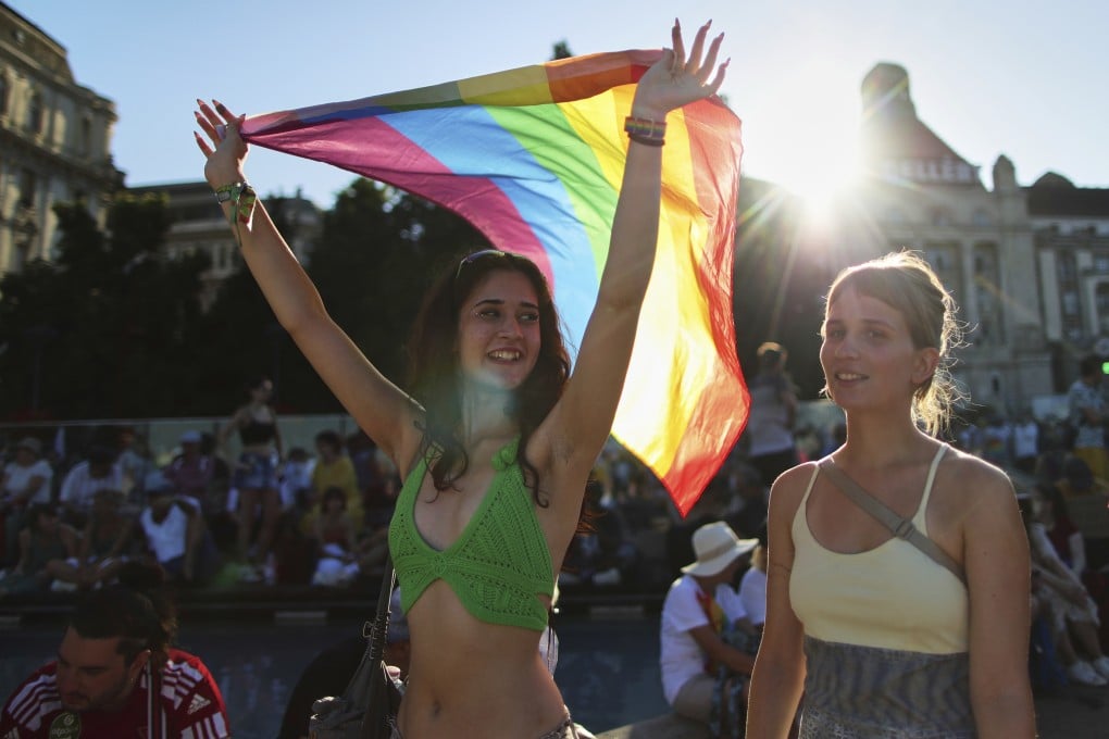 A marcher holds a rainbow flag during the pride parade in Budapest, Hungary, on Saturday. Photo: AP