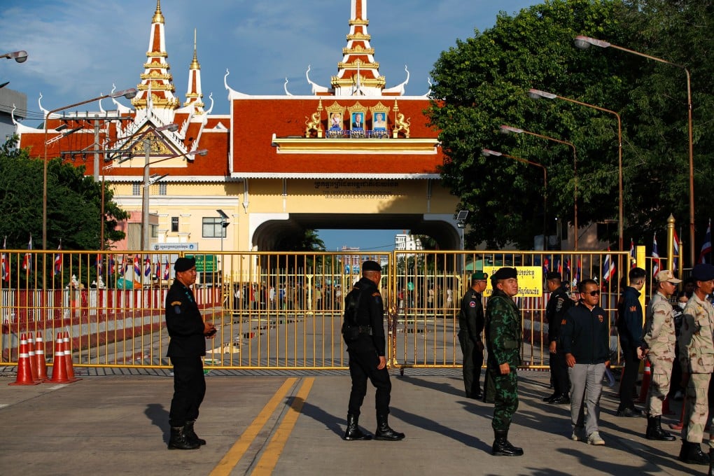 Thai soldiers and security officers stand guard at the closed border gate during a temporary reopening of the border to allow stranded Cambodians and Thais to return home following the border closure at the Ban Klong Luk border checkpoint in Aranyaprathet district, Sa Kaeo province, Thailand, on Tuesday. Photo: EPA