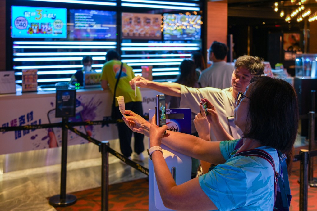 Moviegoers at The Sky at Olympian City on its last day in operation as Golden Harvest closed its four remaining cinemas. Photo: Eugene Lee